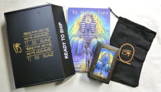The Kemetic Tarot. A Boxed set Comprising the Book "The Kemetic Tarot. Based On the Egyptian Book of Coming Forth by Day" a Boxed Tarot Deck and a Black Silk-like Cloth Bag, Embroidered with an Ankh inside a Cartouche, in Which to Keep the Deck. All in original box - sealed in shrinkwrap.